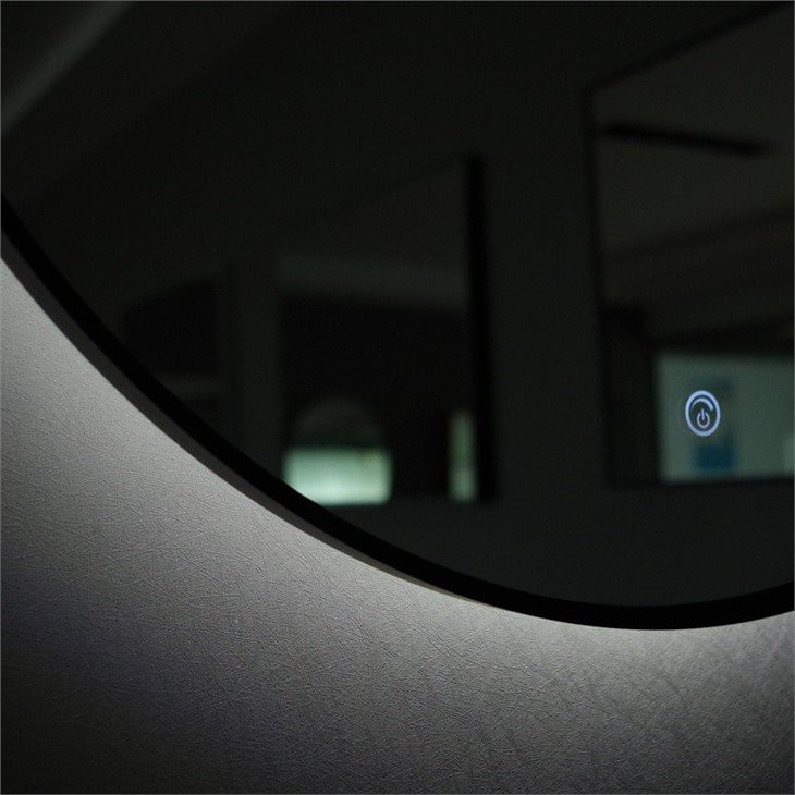 round mirror with light behind 3